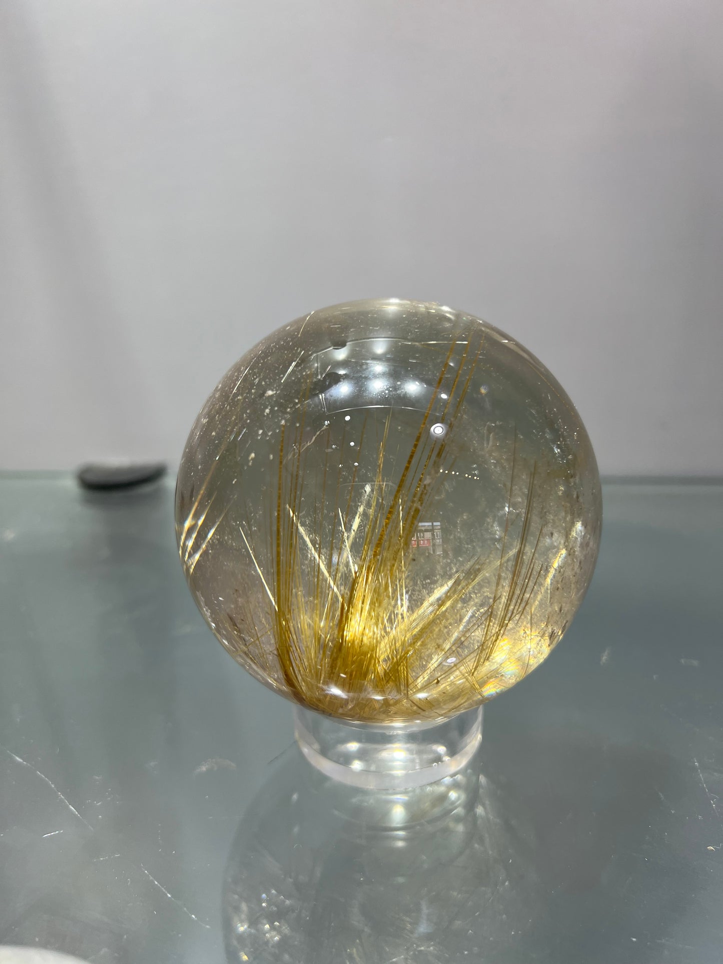 Golden rutitle crystal sphere