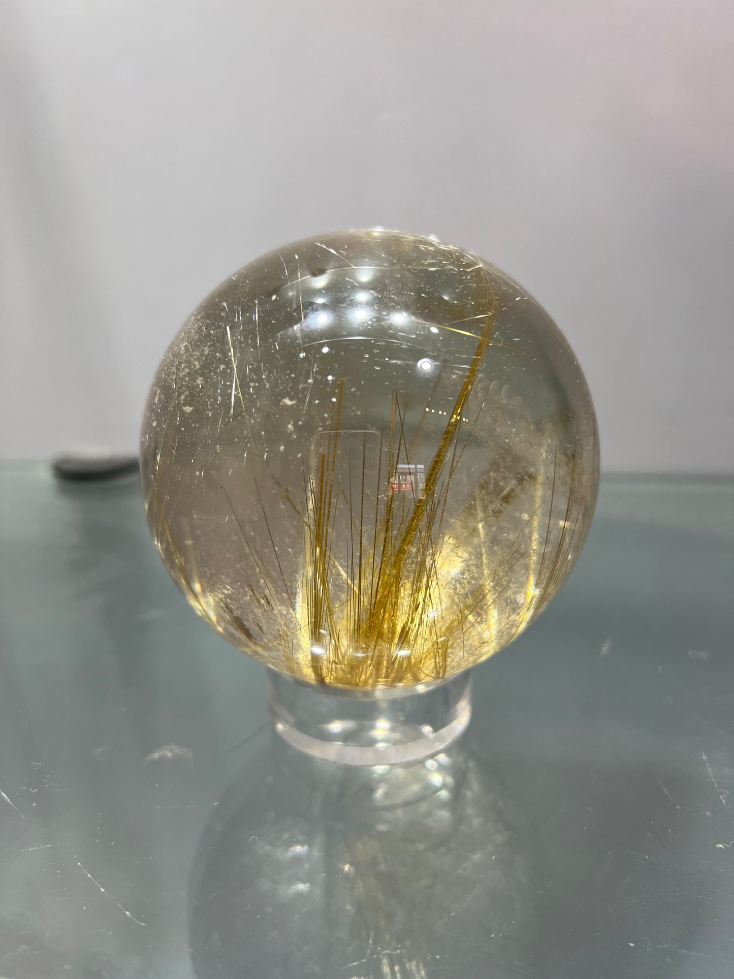 Golden rutitle crystal sphere