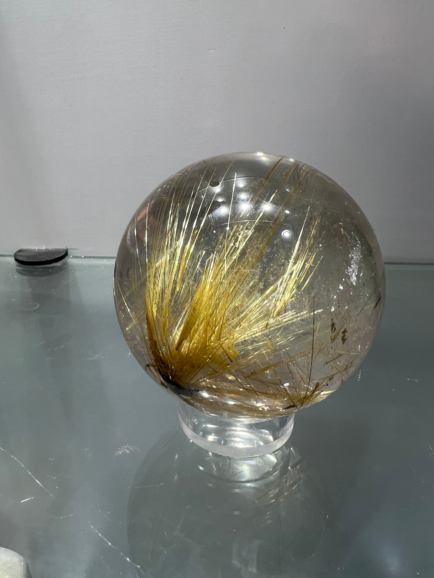 Golden rutitle crystal sphere