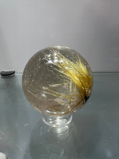 Golden rutitle crystal sphere