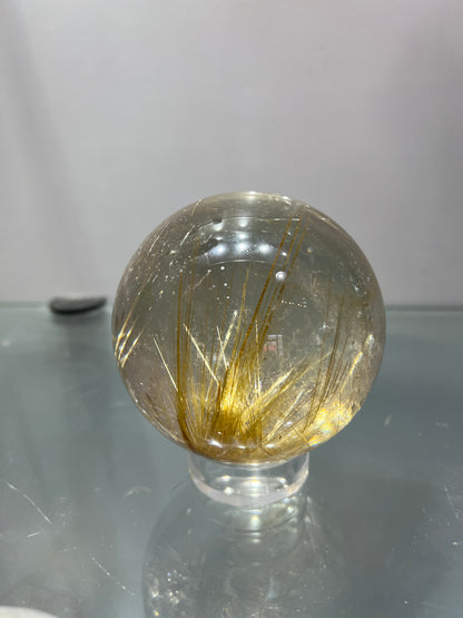 Golden rutitle crystal sphere